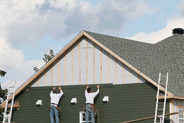 Professional Siding technician working in Maple, NC
